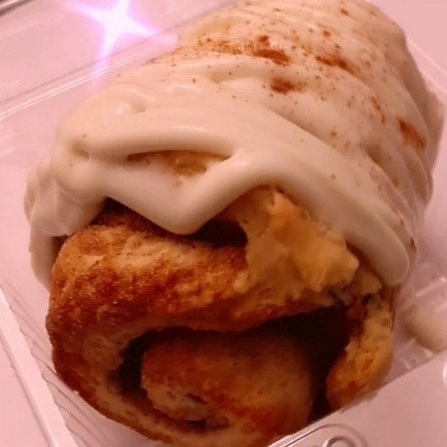 Original Gangsta Cinnamon is a giant southern cinnamon topped with a hefty amount of cream cheese icing and finished with fresh cinnamon.